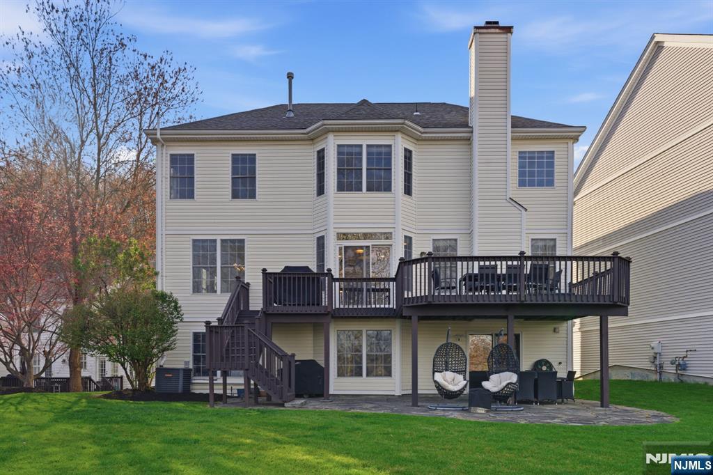 22 Falling Waters Oakland, NJ 07436 - Photo 36 of 43 a front view of a house with garden