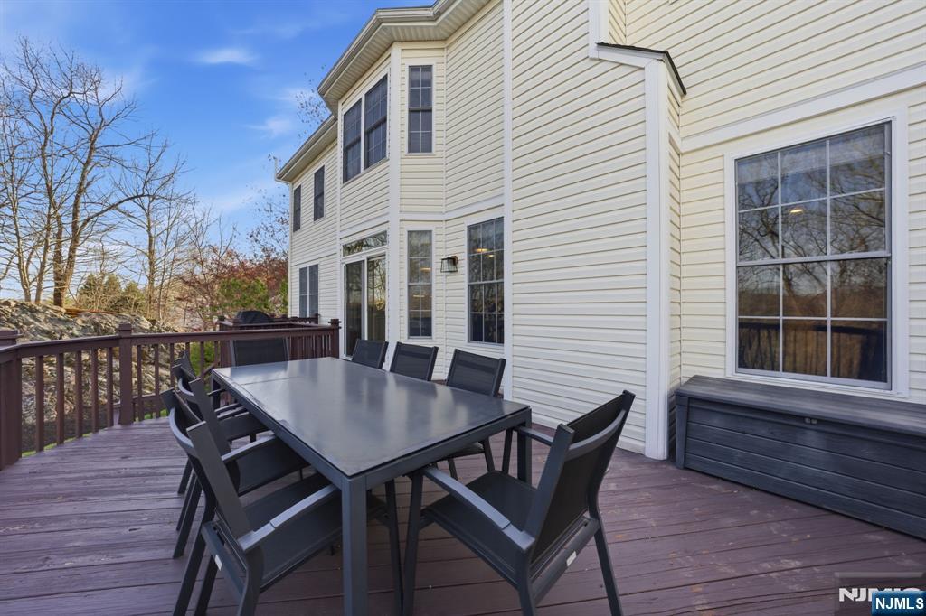 22 Falling Waters Oakland, NJ 07436 - Photo 40 of 43 a view of a chairs and table on the deck