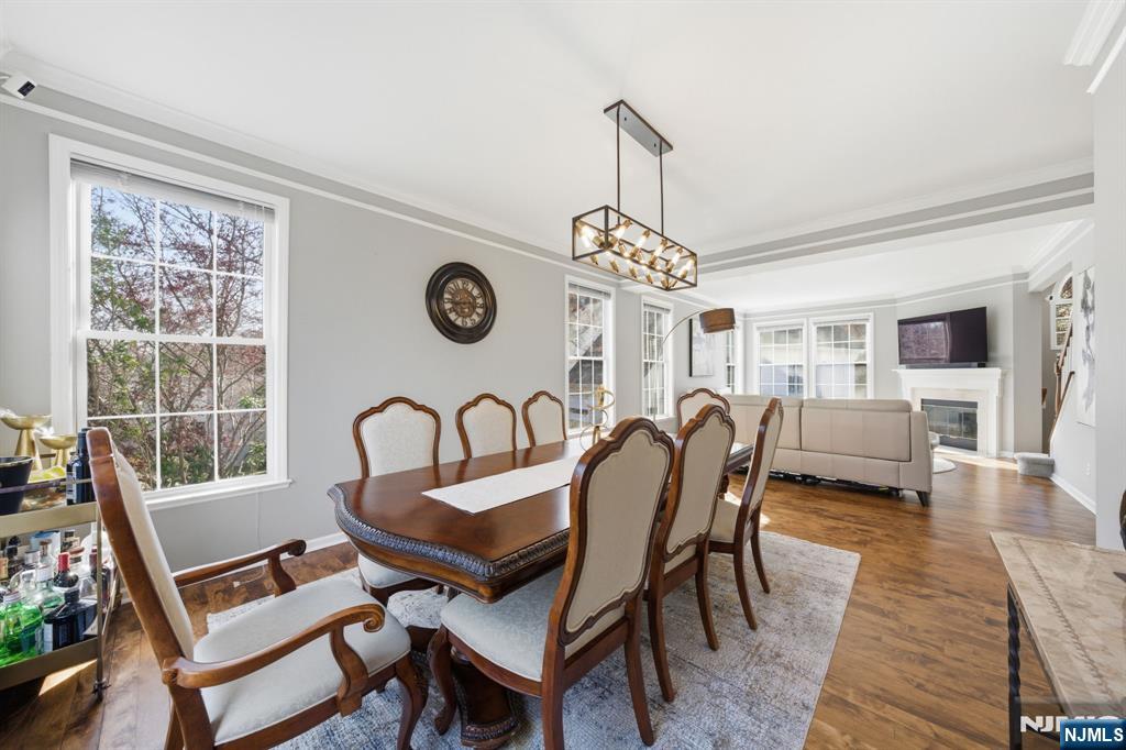 22 Falling Waters Oakland, NJ 07436 - Photo 6 of 43 a view of a dining room filled with furniture window and wooden floor