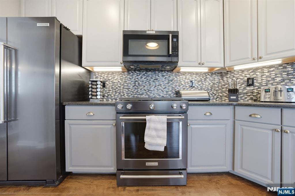 22 Falling Waters Oakland, NJ 07436 - Photo 10 of 43 a kitchen with stainless steel appliances granite countertop a refrigerator and a stove