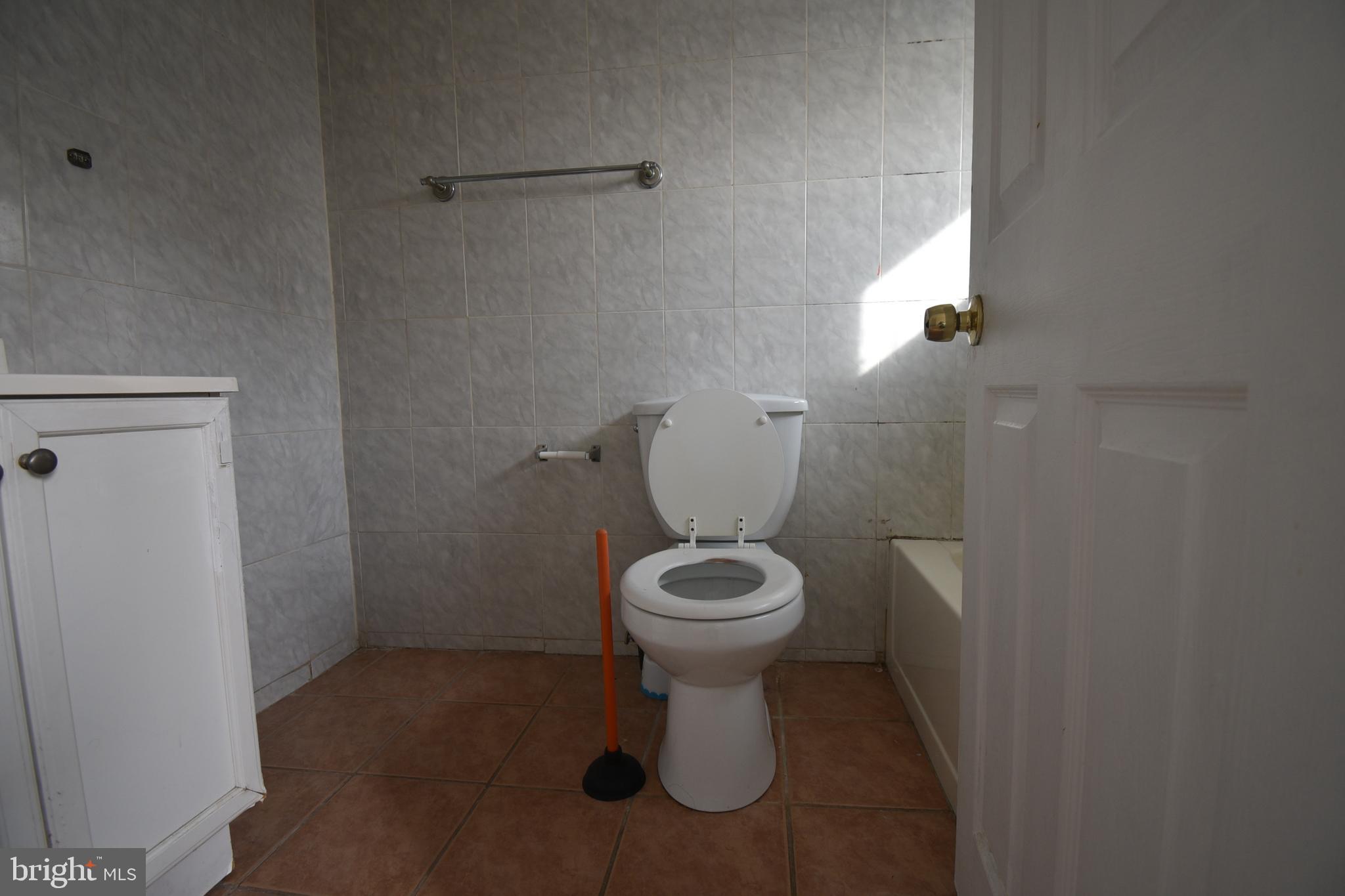 1303 South 8th Street Philadelphia, PA 19147 - Photo 14 of 22 a white toilet sitting next to a white sink