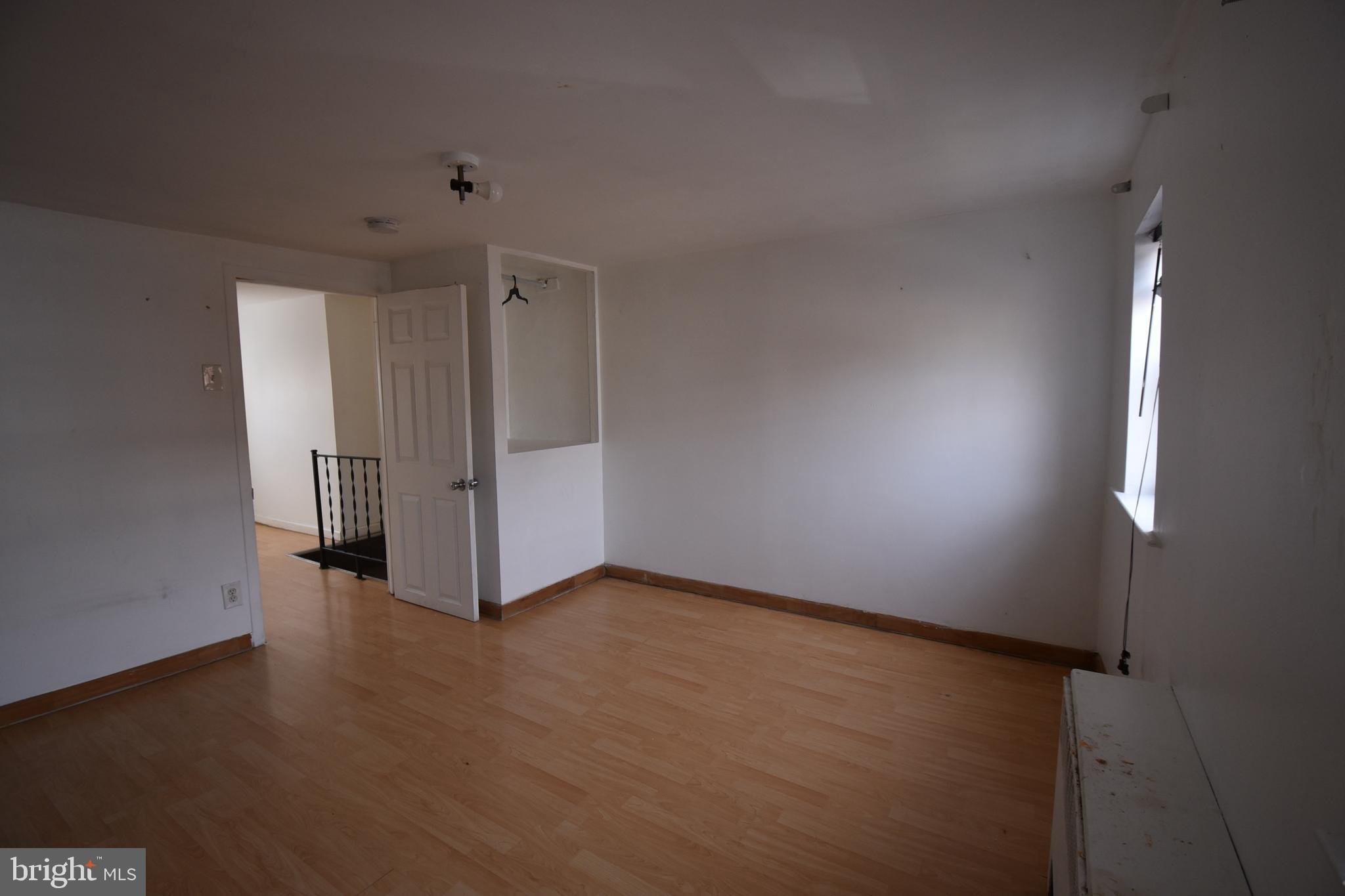 1303 South 8th Street Philadelphia, PA 19147 - Photo 18 of 22 an empty room with a door
