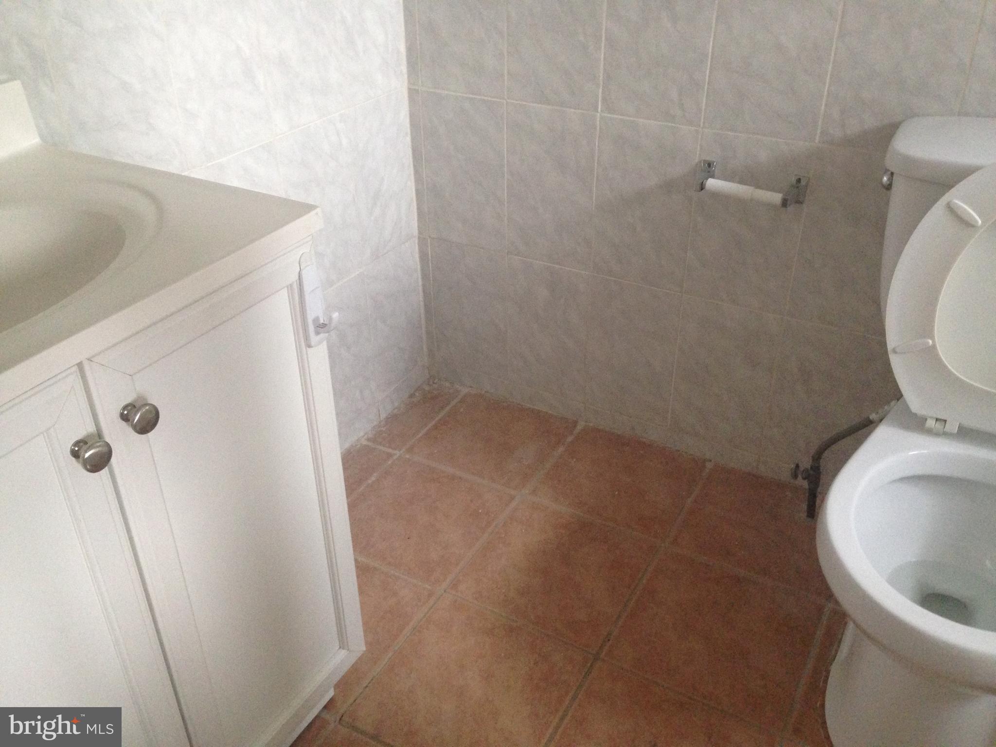 1303 South 8th Street Philadelphia, PA 19147 - Photo 22 of 22 a bathroom with a sink and toilet