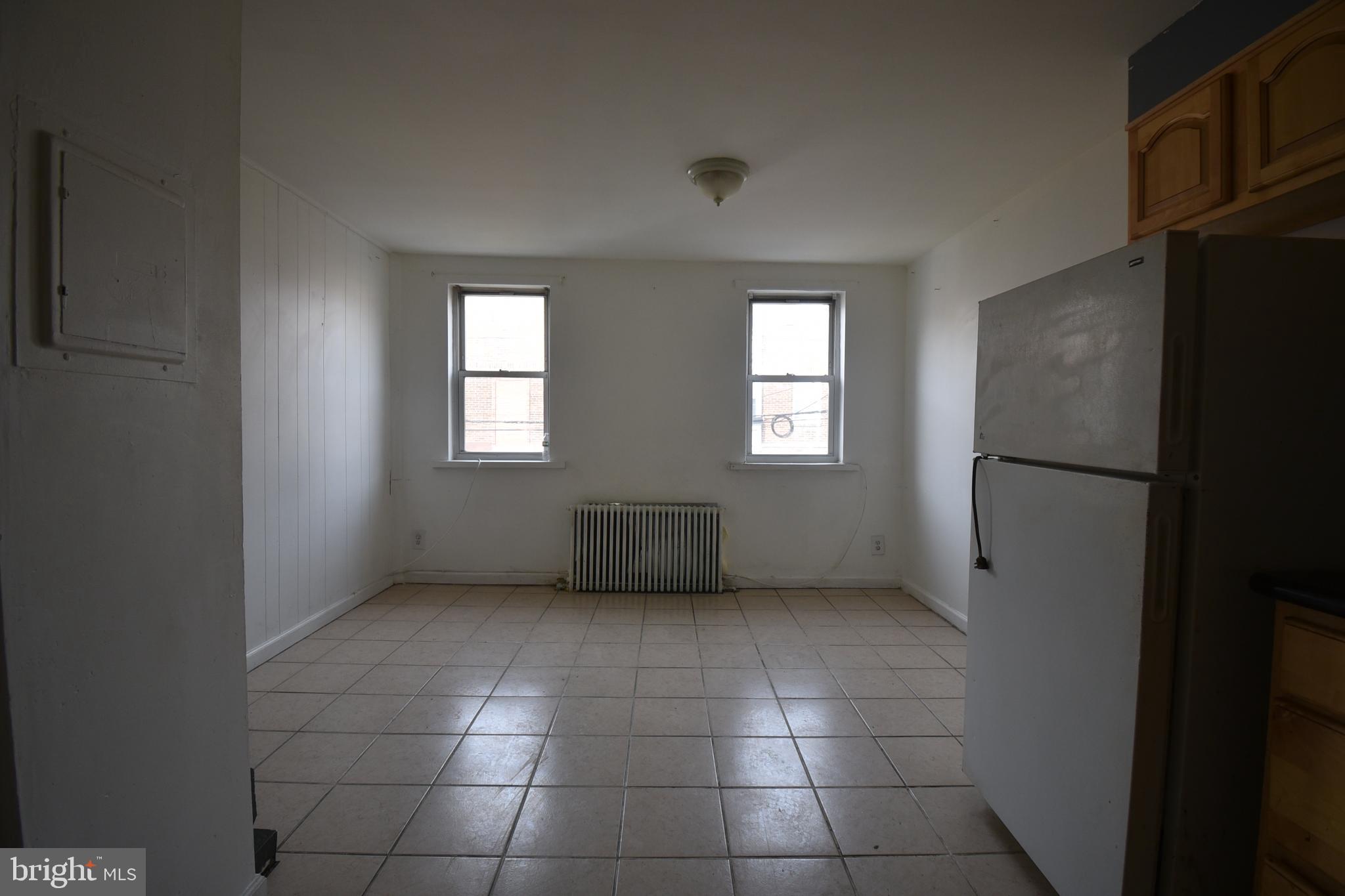1303 South 8th Street Philadelphia, PA 19147 - Photo 7 of 22 a view of an empty room with windows and closet