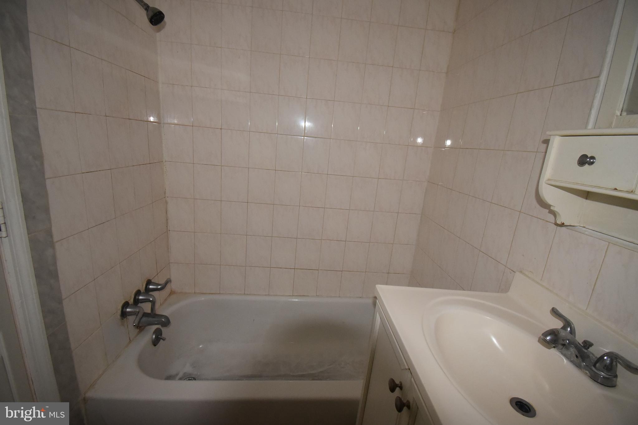 1303 South 8th Street Philadelphia, PA 19147 - Photo 9 of 22 a bathroom with a sink and shower