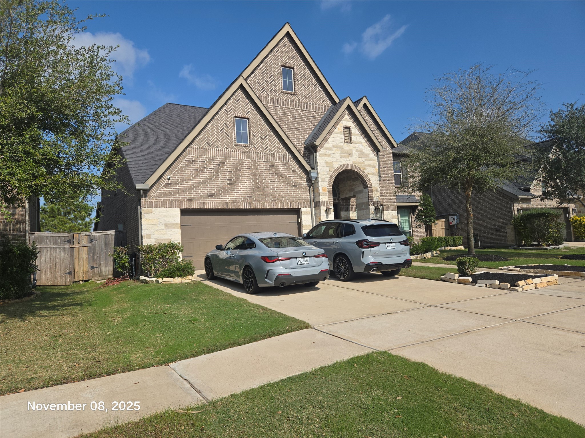 28610 Thornsby Ridge Court Fulshear, TX 77441 - Photo 5 of 7 a view of a house with a yard and plants