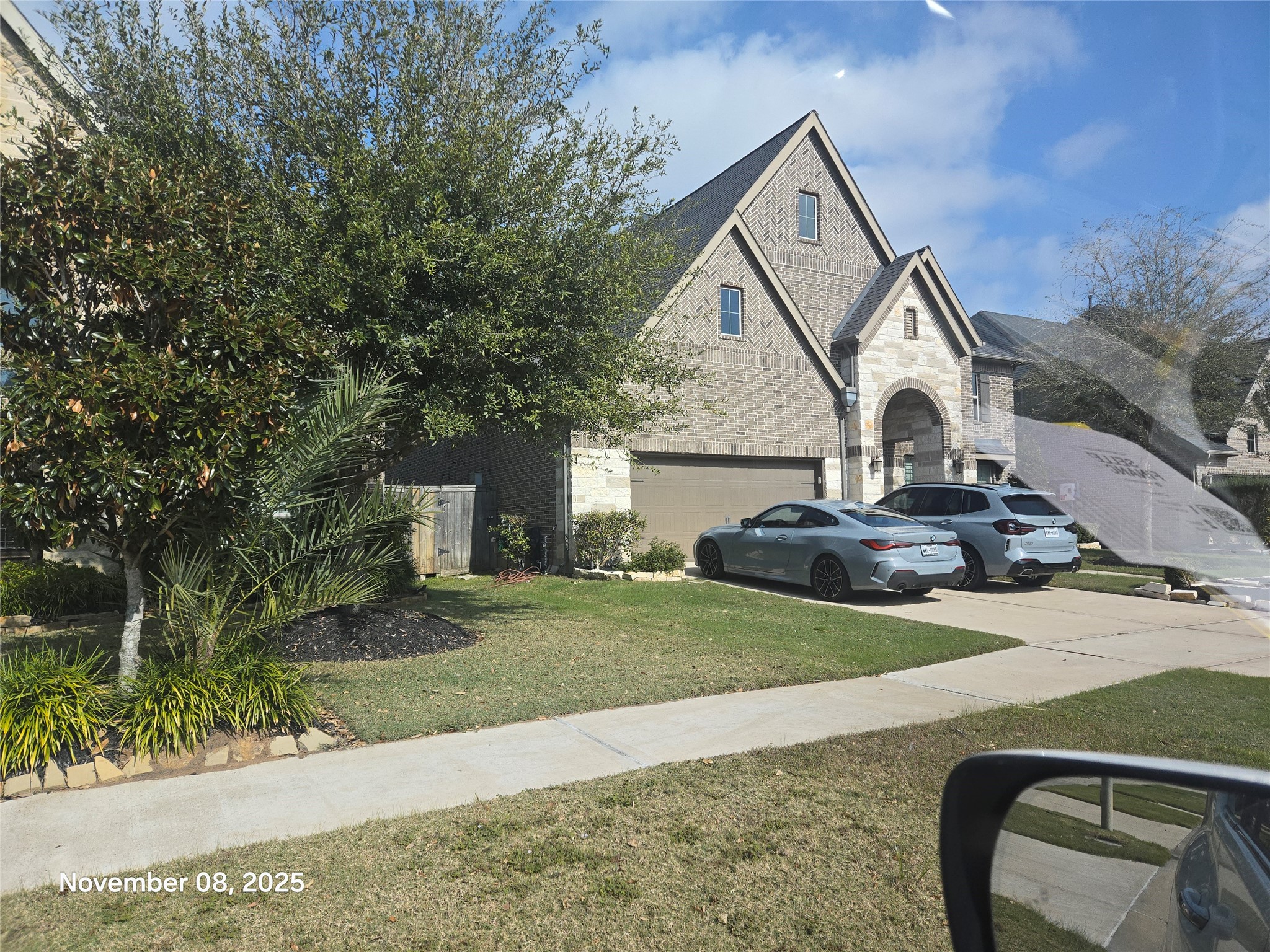 28610 Thornsby Ridge Court Fulshear, TX 77441 - Photo 7 of 7 a front view of a house with garden