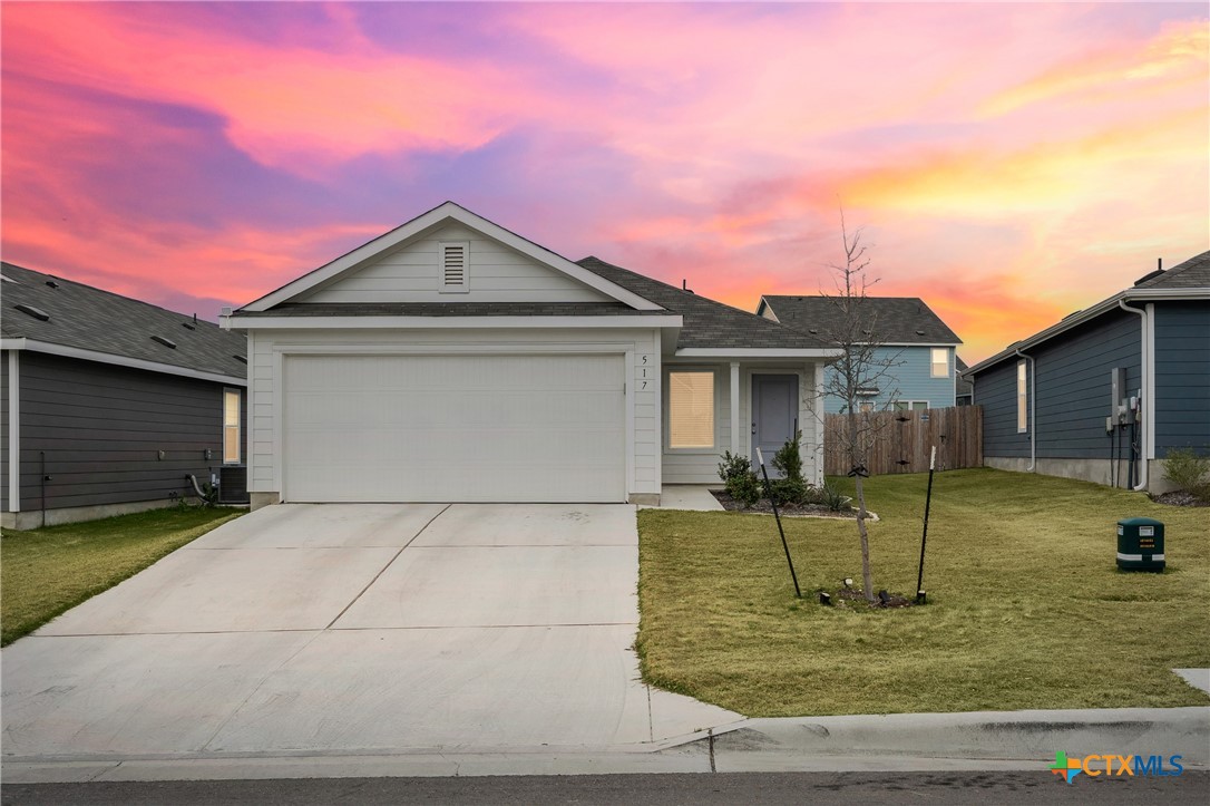 a view of a house with a yard