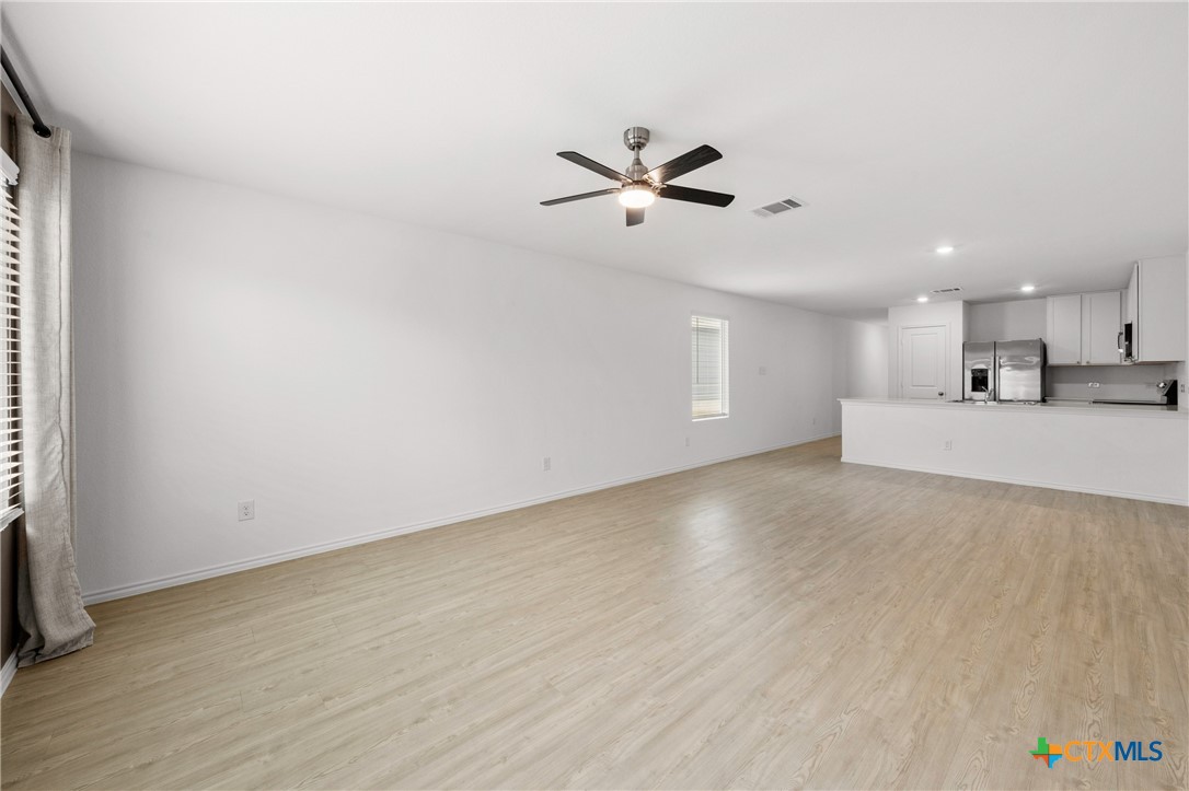 517 Texas Angel Way Jarrell, TX 76537 - Photo 14 of 35 a view of a kitchen with a sink and a window