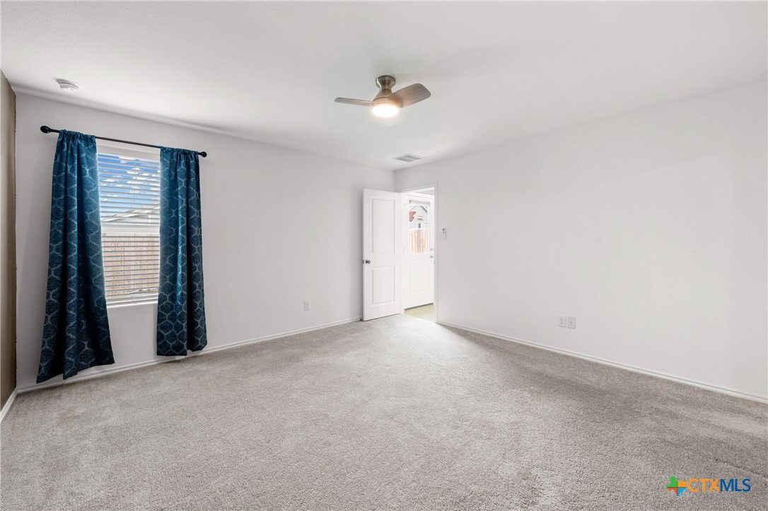 517 Texas Angel Way Jarrell, TX 76537 - Photo 16 of 35 a view of an empty room with a window
