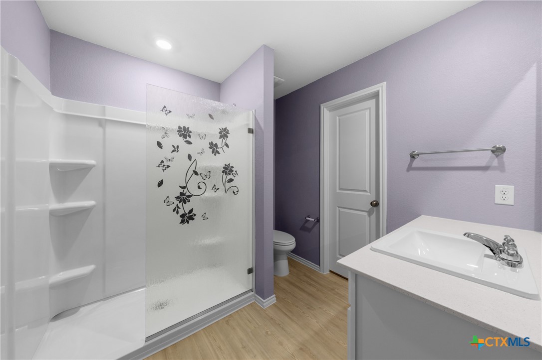 517 Texas Angel Way Jarrell, TX 76537 - Photo 17 of 35 a bathroom with a shower and a sink