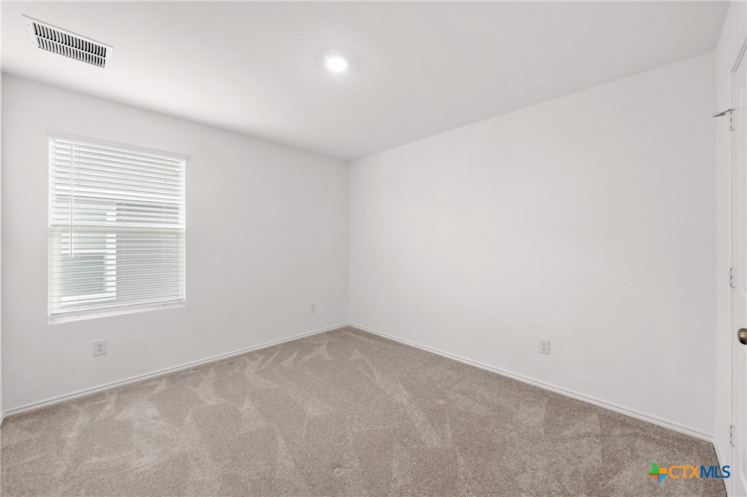 517 Texas Angel Way Jarrell, TX 76537 - Photo 25 of 35 an empty room with a window
