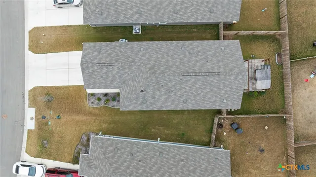 an aerial view of a house with a ocean view