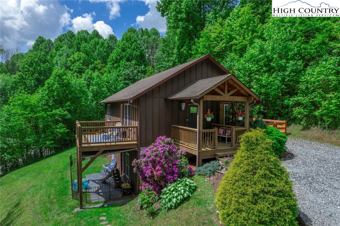 198 Eagles Path Boone, NC 28607 - Photo 2 of 44 a front view of a house with garden