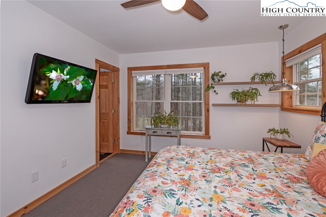198 Eagles Path Boone, NC 28607 - Photo 26 of 44 a bedroom with furniture and a flat screen tv