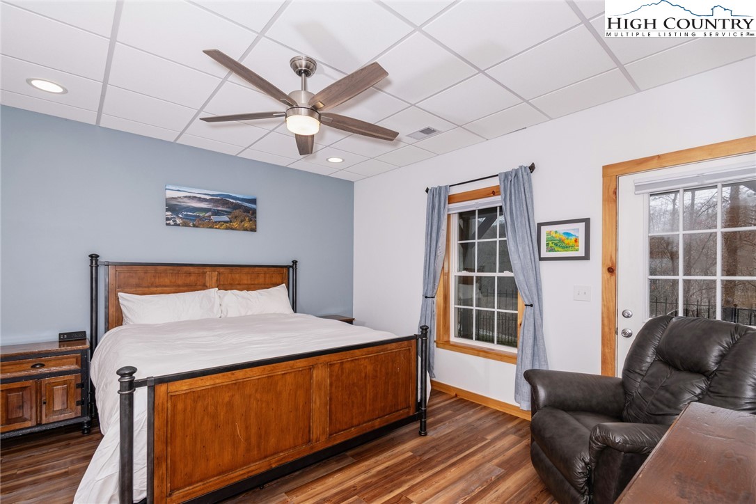 198 Eagles Path Boone, NC 28607 - Photo 39 of 44 a bedroom with a bed and wooden floor