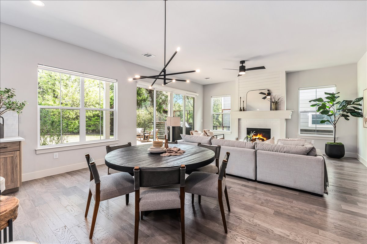 7910 Ryans Way Austin, TX 78726 - Photo 14 of 39 The open-concept layout creates a seamless flow between the kitchen, dining, and living spaces.