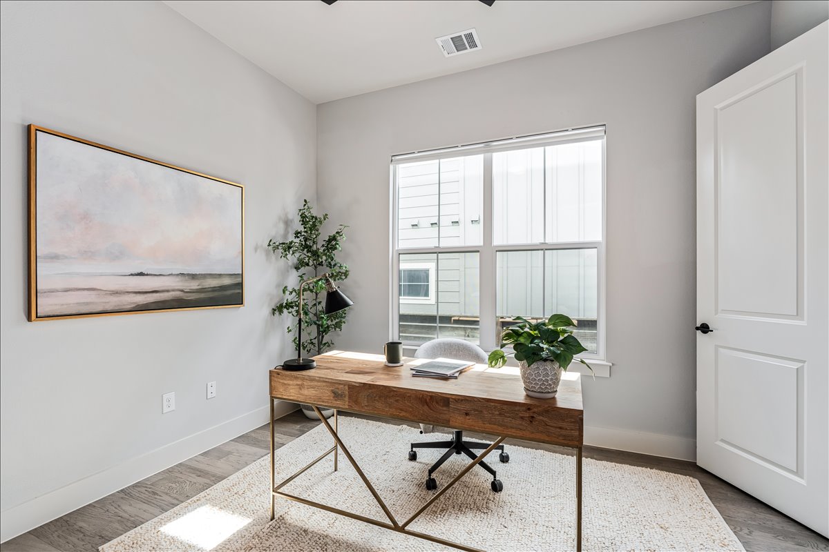 7910 Ryans Way Austin, TX 78726 - Photo 15 of 39 The dedicated home office offers a quiet and productive workspace with large windows that bring in natural light.
