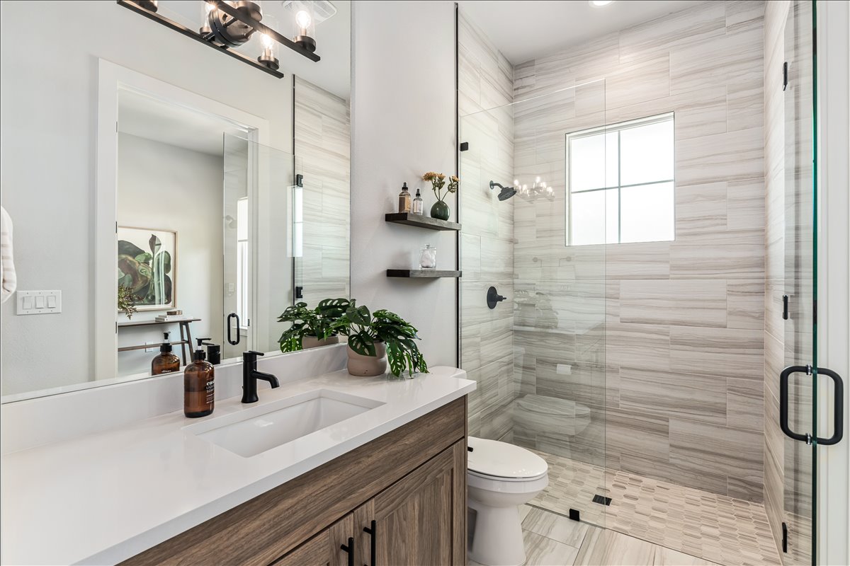 7910 Ryans Way Austin, TX 78726 - Photo 17 of 39 The downstairs guest bathroom features a modern vanity with sleek finishes and ample storage.