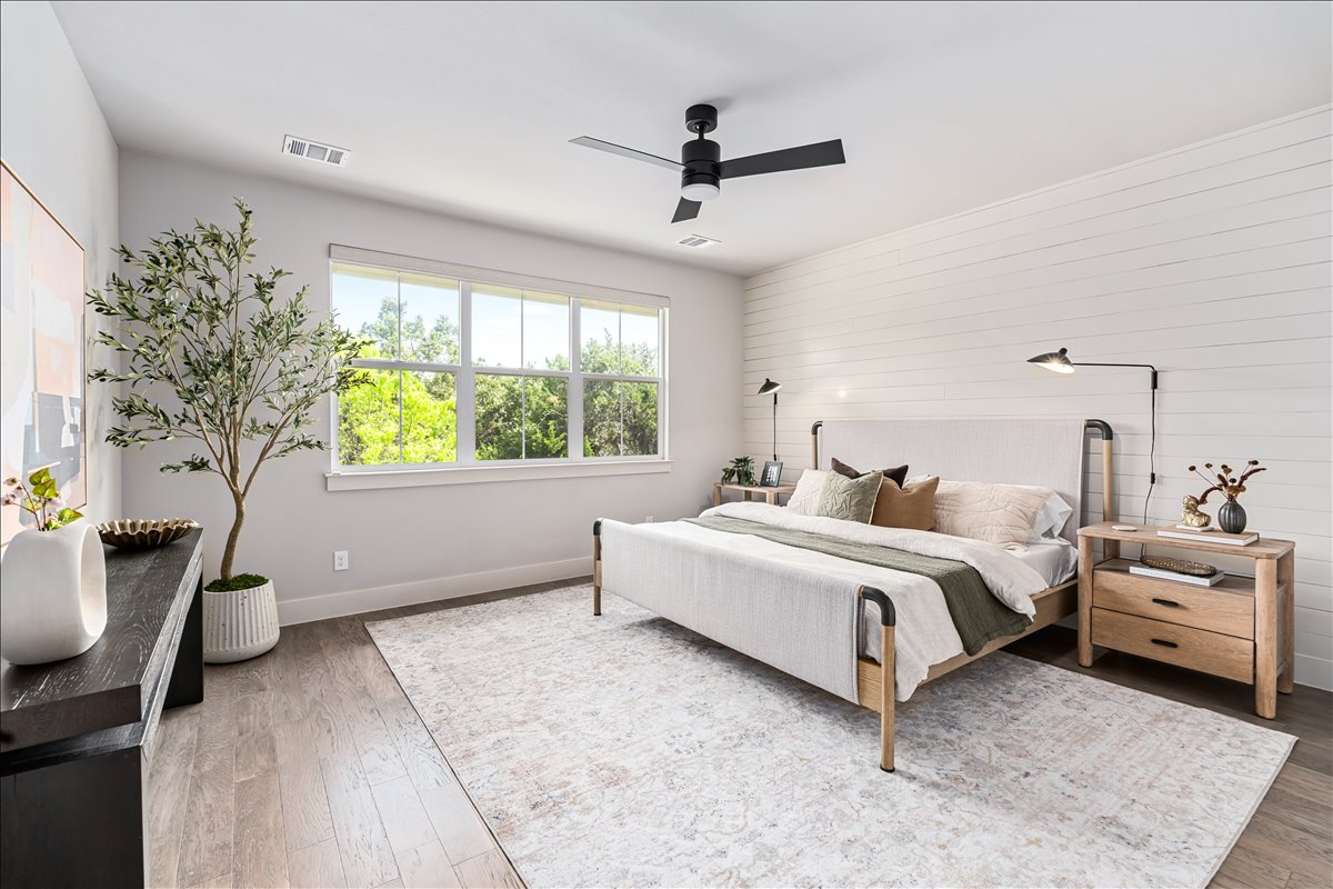 7910 Ryans Way Austin, TX 78726 - Photo 19 of 39 The spacious primary bedroom offers a peaceful retreat with soft natural light and calming neutral tones.