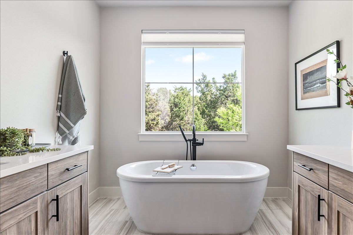 7910 Ryans Way Austin, TX 78726 - Photo 23 of 39 Natural light enhances the relaxing feel of the bathroom space.