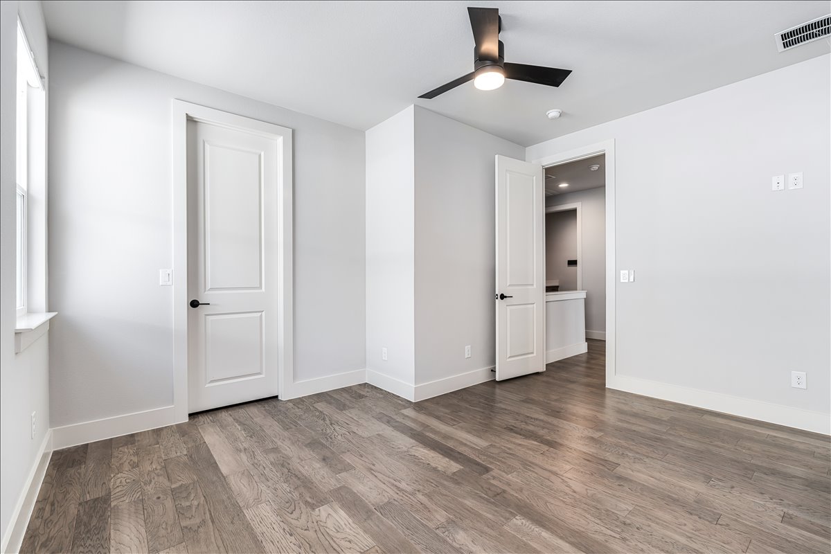 7910 Ryans Way Austin, TX 78726 - Photo 29 of 39 Wide plank flooring and clean design elements continue the cohesive look found throughout the home.