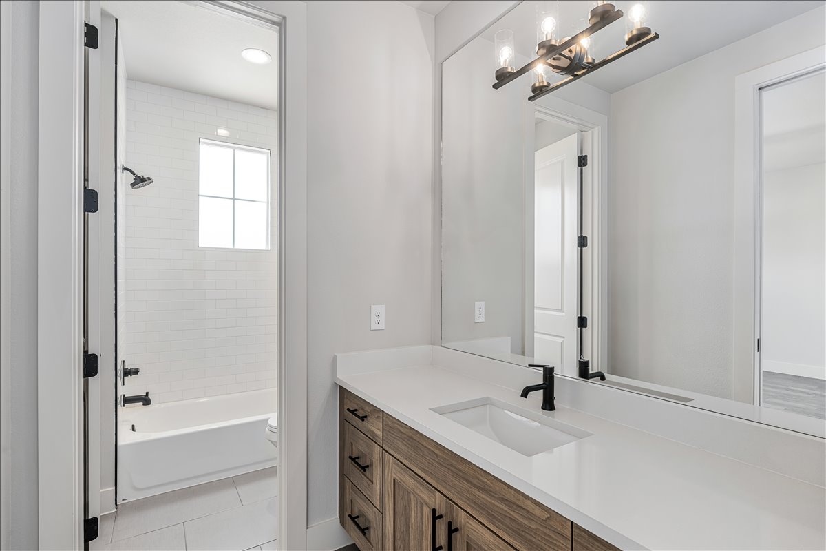 7910 Ryans Way Austin, TX 78726 - Photo 30 of 39 Clean lines and thoughtful design create a polished space in this guest bathroom.