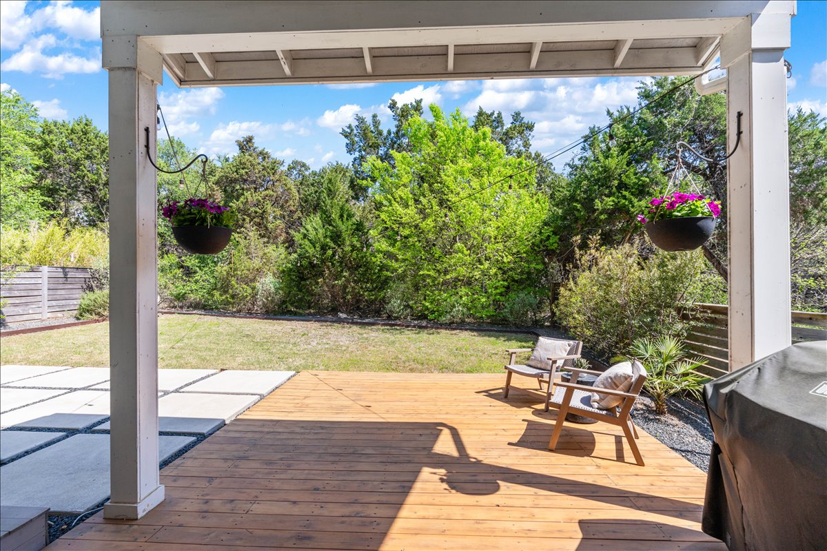 7910 Ryans Way Austin, TX 78726 - Photo 34 of 39 The covered patio extends the living space outdoors, perfect for relaxing or entertaining.