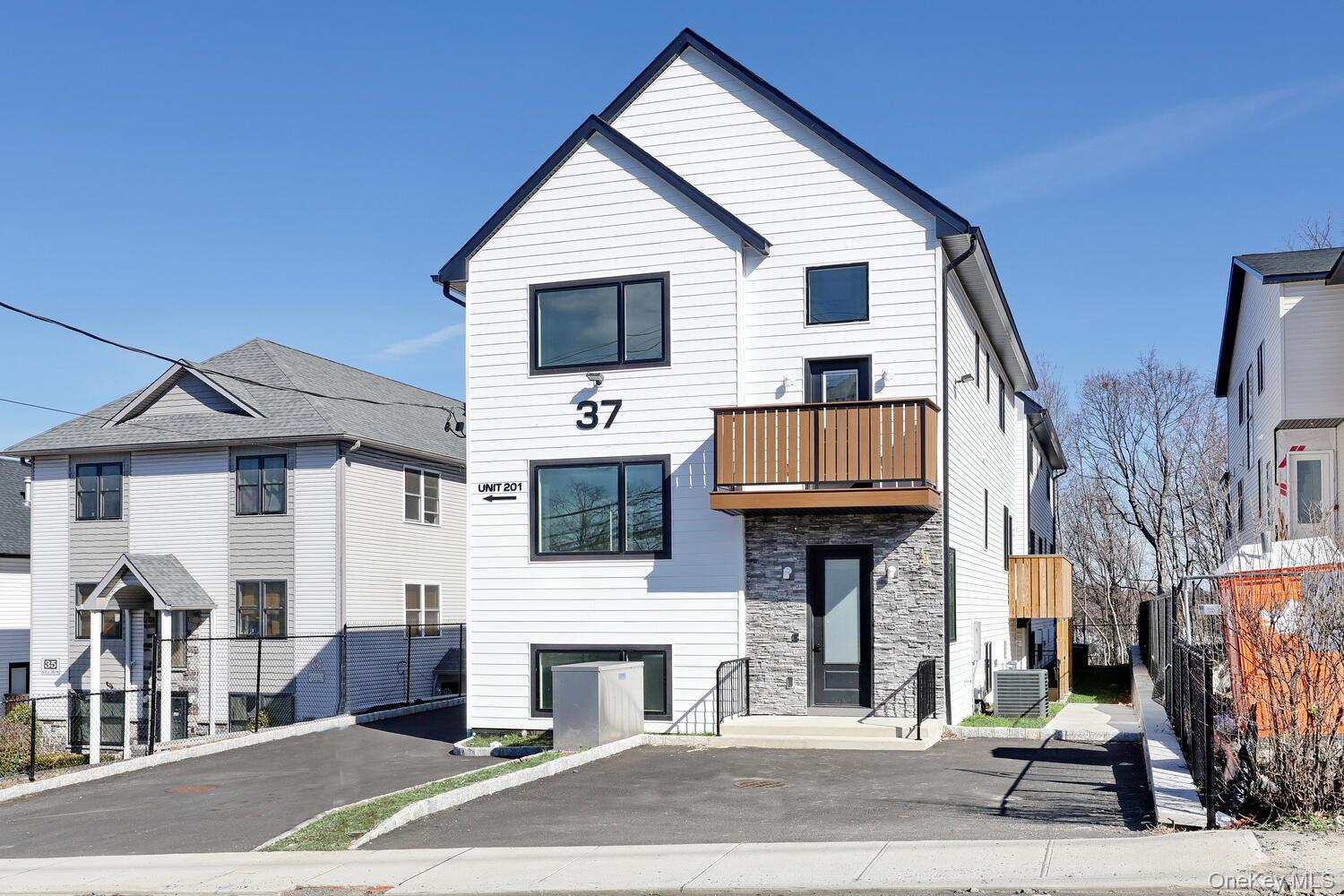 a view of a house with a street