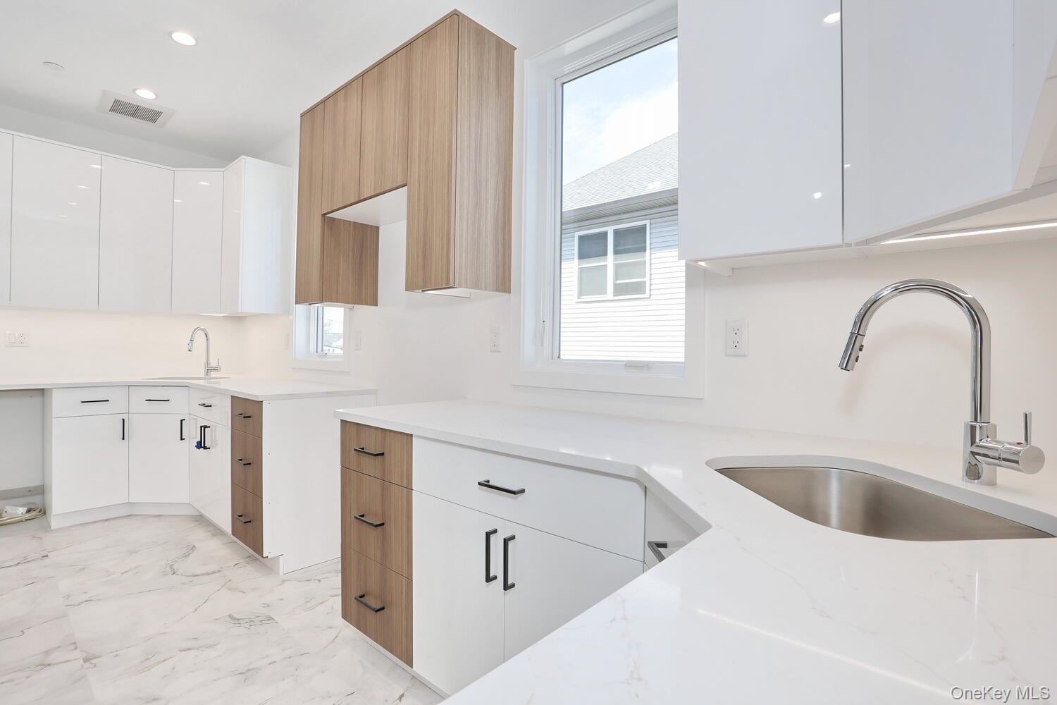 37 Ewing Avenue, Unit 202 Spring Valley, NY 10977 - Photo 11 of 50 a kitchen with cabinets appliances and a window
