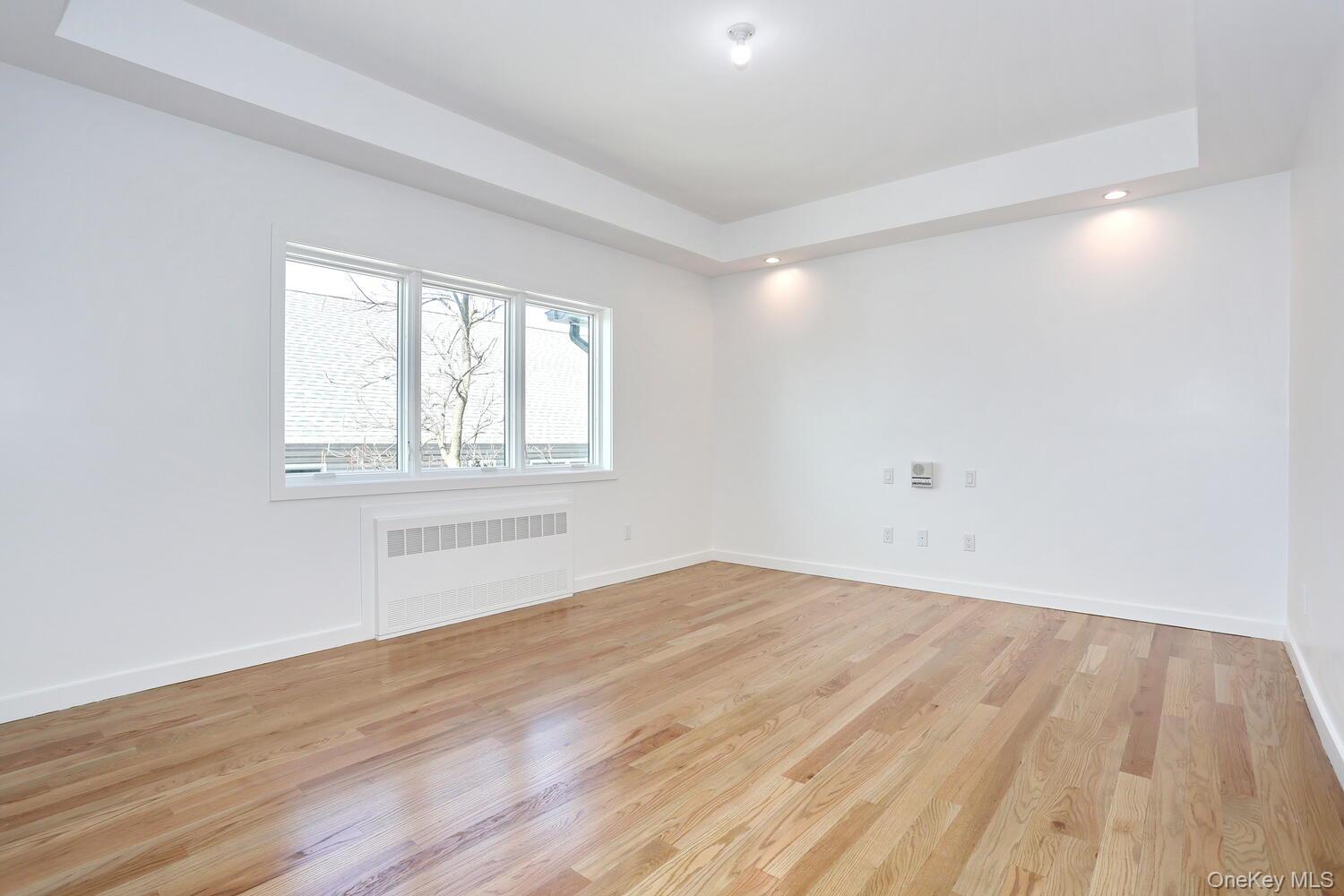 37 Ewing Avenue, Unit 202 Spring Valley, NY 10977 - Photo 19 of 50 wooden floor in an empty room with a window