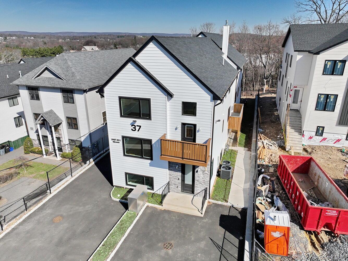 37 Ewing Avenue, Unit 202 Spring Valley, NY 10977 - Photo 2 of 50 an aerial view of a house with swimming pool