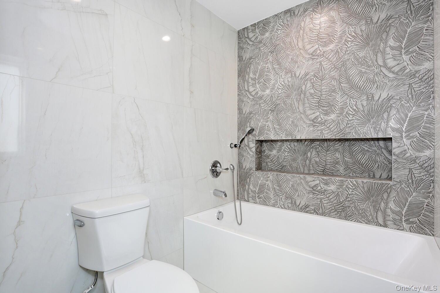 37 Ewing Avenue, Unit 202 Spring Valley, NY 10977 - Photo 23 of 50 a bathroom with a toilet and a bathtub