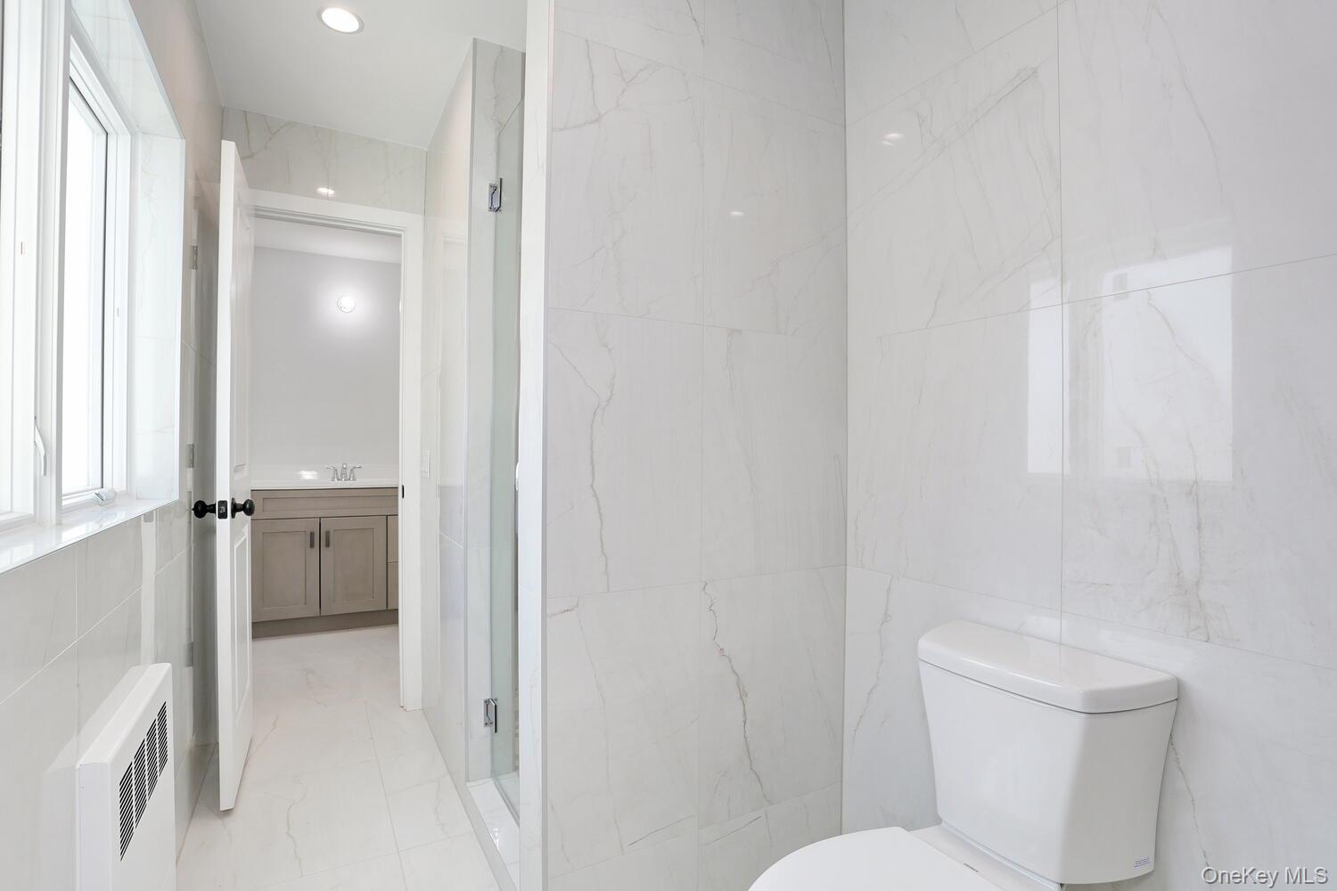 37 Ewing Avenue, Unit 202 Spring Valley, NY 10977 - Photo 25 of 50 a bathroom with a toilet and a shower
