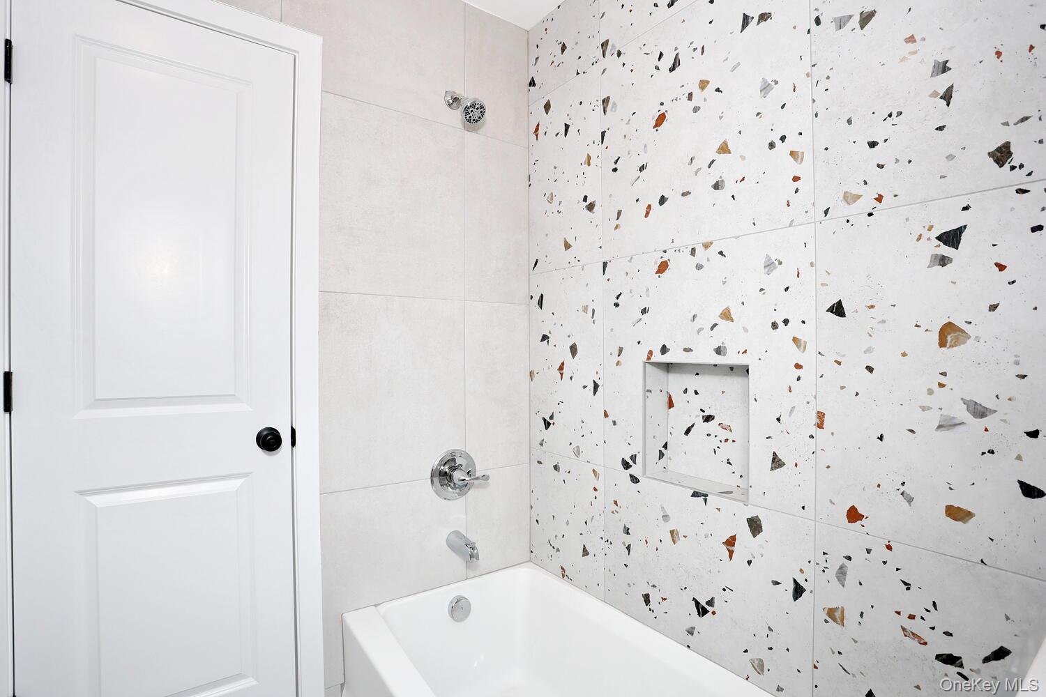 37 Ewing Avenue, Unit 202 Spring Valley, NY 10977 - Photo 29 of 50 a bathroom with a bathtub and shower
