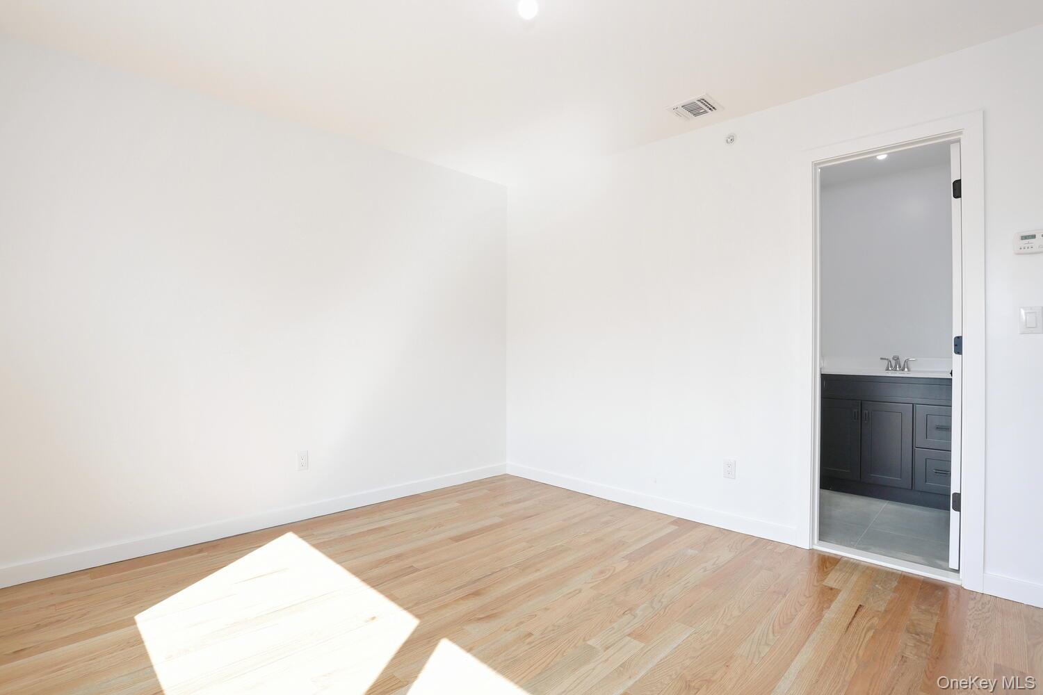 37 Ewing Avenue, Unit 202 Spring Valley, NY 10977 - Photo 30 of 50 a view of empty room with wooden floor