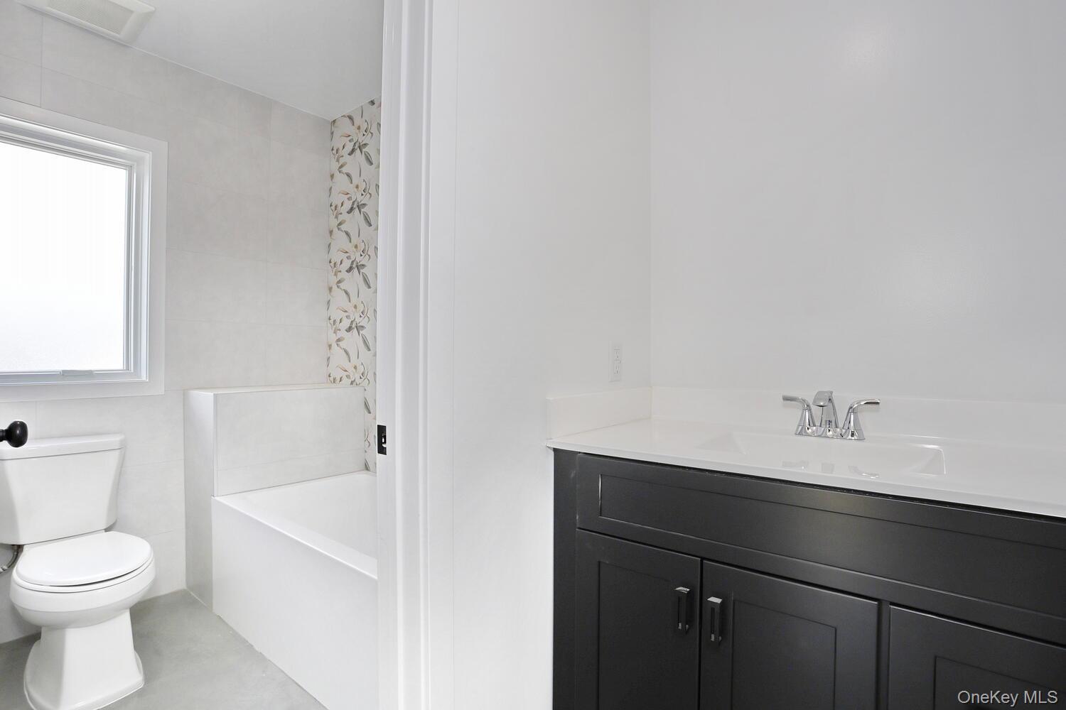 37 Ewing Avenue, Unit 202 Spring Valley, NY 10977 - Photo 31 of 50 a bathroom with a bathtub and a toilet