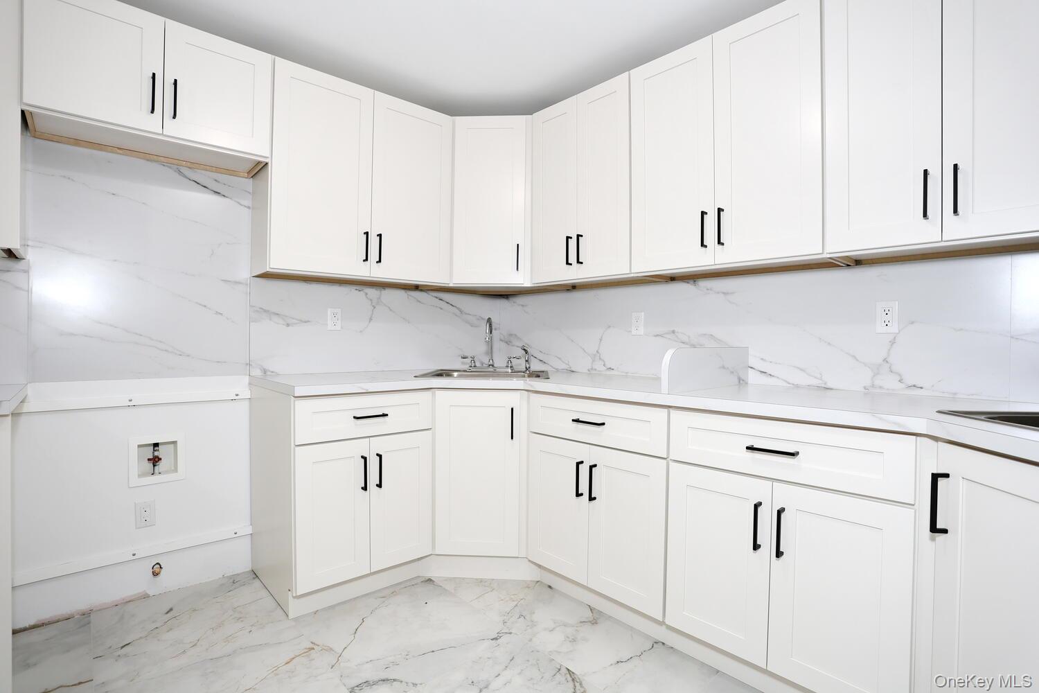 37 Ewing Avenue, Unit 202 Spring Valley, NY 10977 - Photo 36 of 50 a kitchen with white cabinets and white appliances