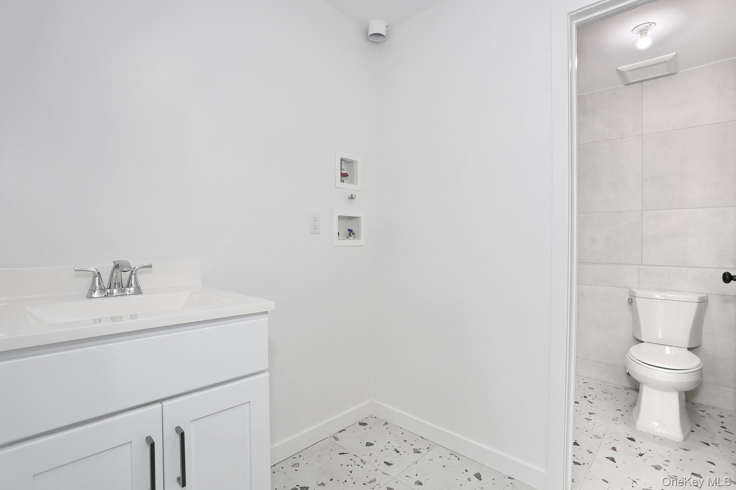 37 Ewing Avenue, Unit 202 Spring Valley, NY 10977 - Photo 39 of 50 a bathroom with a sink toilet and a mirror
