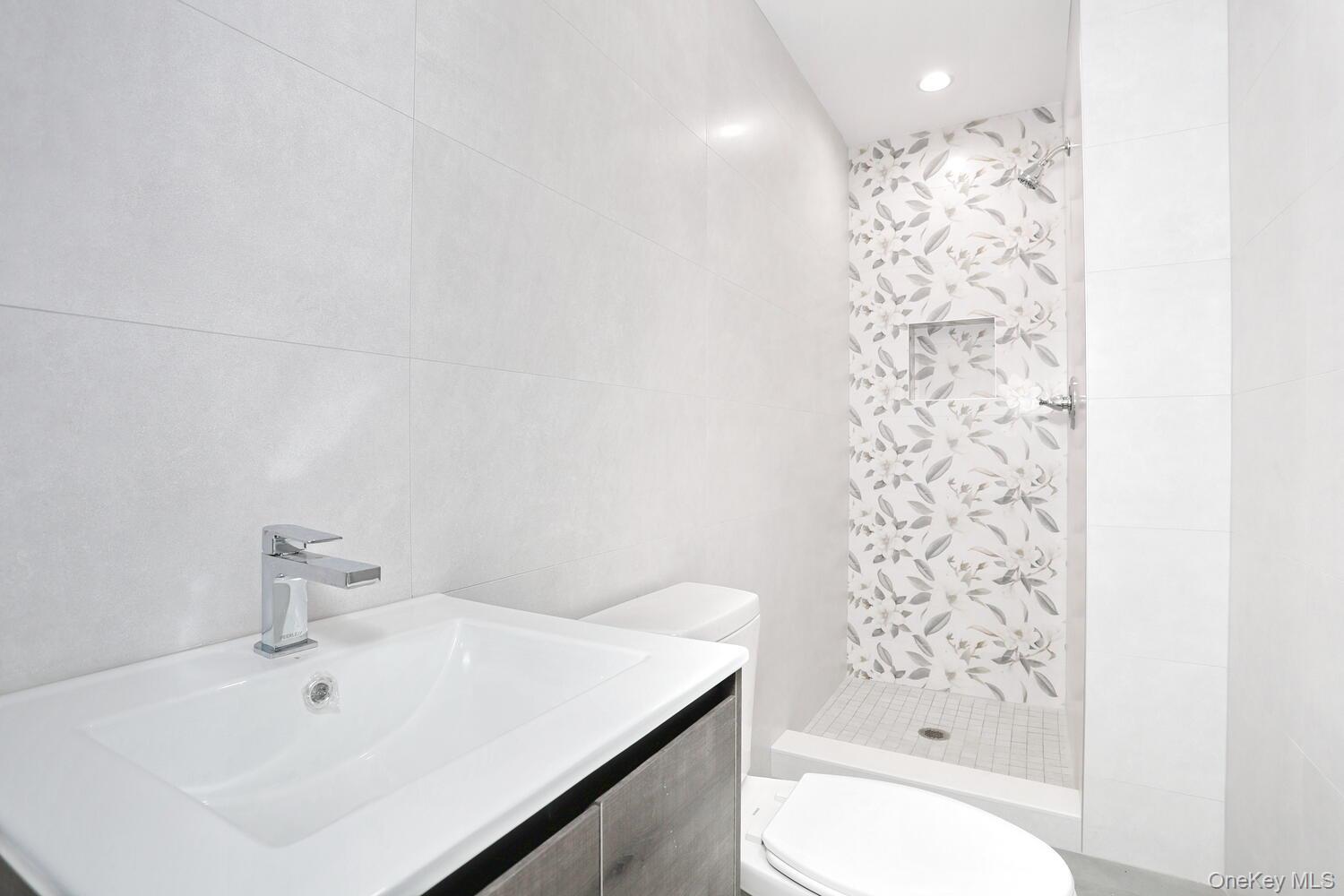 37 Ewing Avenue, Unit 202 Spring Valley, NY 10977 - Photo 42 of 50 a bathroom with a bathtub sink and toilet