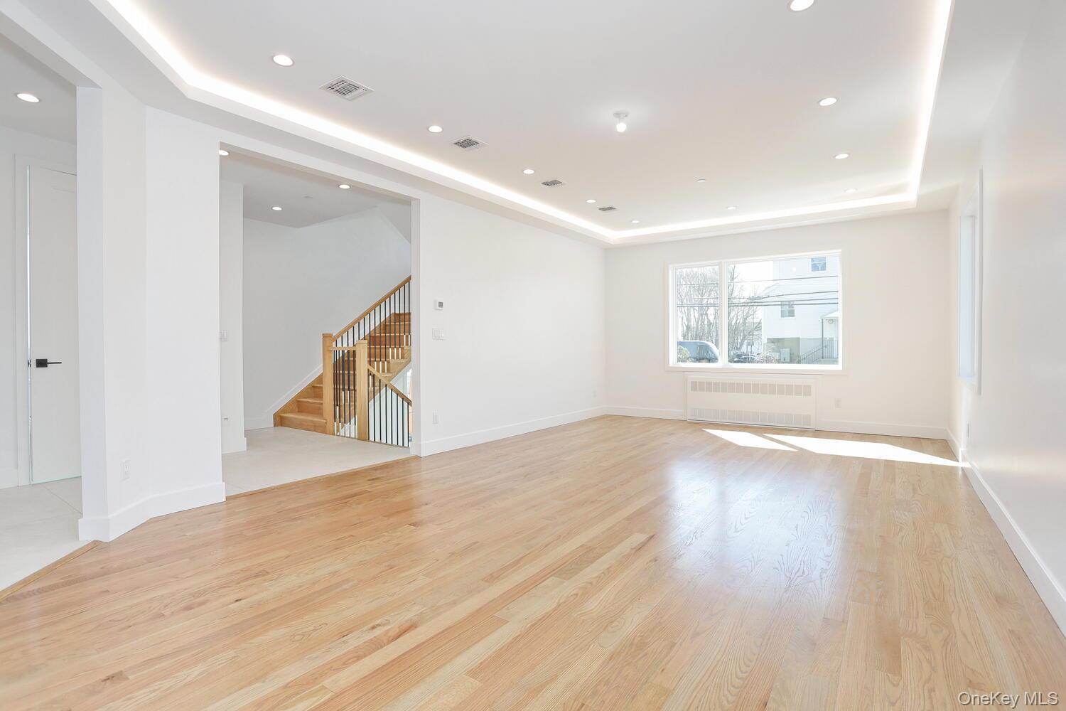 37 Ewing Avenue, Unit 202 Spring Valley, NY 10977 - Photo 6 of 50 a view of an empty room with wooden floor and a window