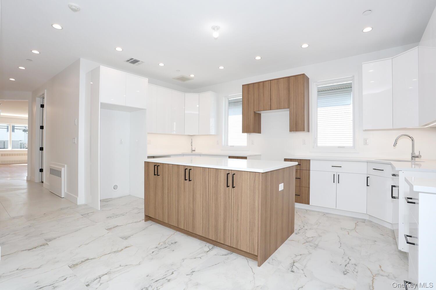 37 Ewing Avenue, Unit 202 Spring Valley, NY 10977 - Photo 10 of 50 a kitchen with a sink window and cabinets