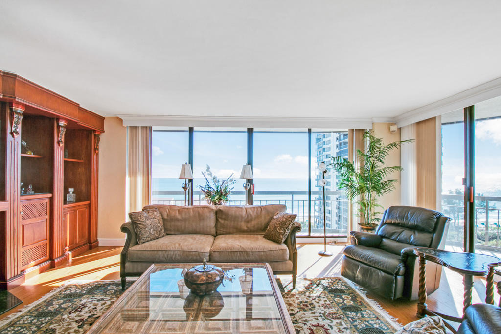 4100 North Ocean Drive, Unit 1002 Singer Island, FL 33404 - Photo 1 of 37 a living room with furniture and a large window