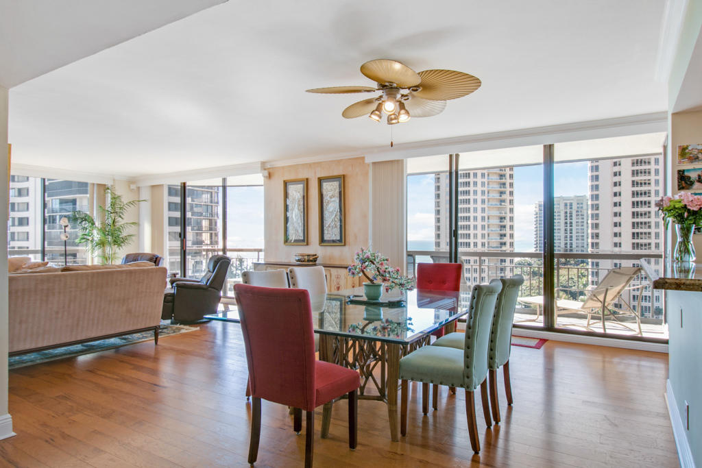 4100 North Ocean Drive, Unit 1002 Singer Island, FL 33404 - Photo 13 of 37 a view of a dining room with furniture window and wooden floor