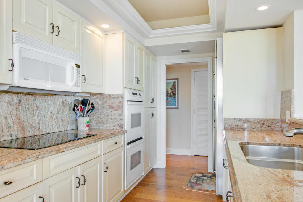 4100 North Ocean Drive, Unit 1002 Singer Island, FL 33404 - Photo 14 of 37 a bathroom with a sink and a mirror
