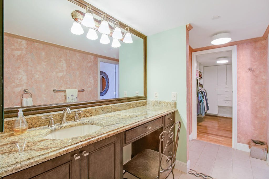 4100 North Ocean Drive, Unit 1002 Singer Island, FL 33404 - Photo 18 of 37 a bathroom with a sink and a mirror