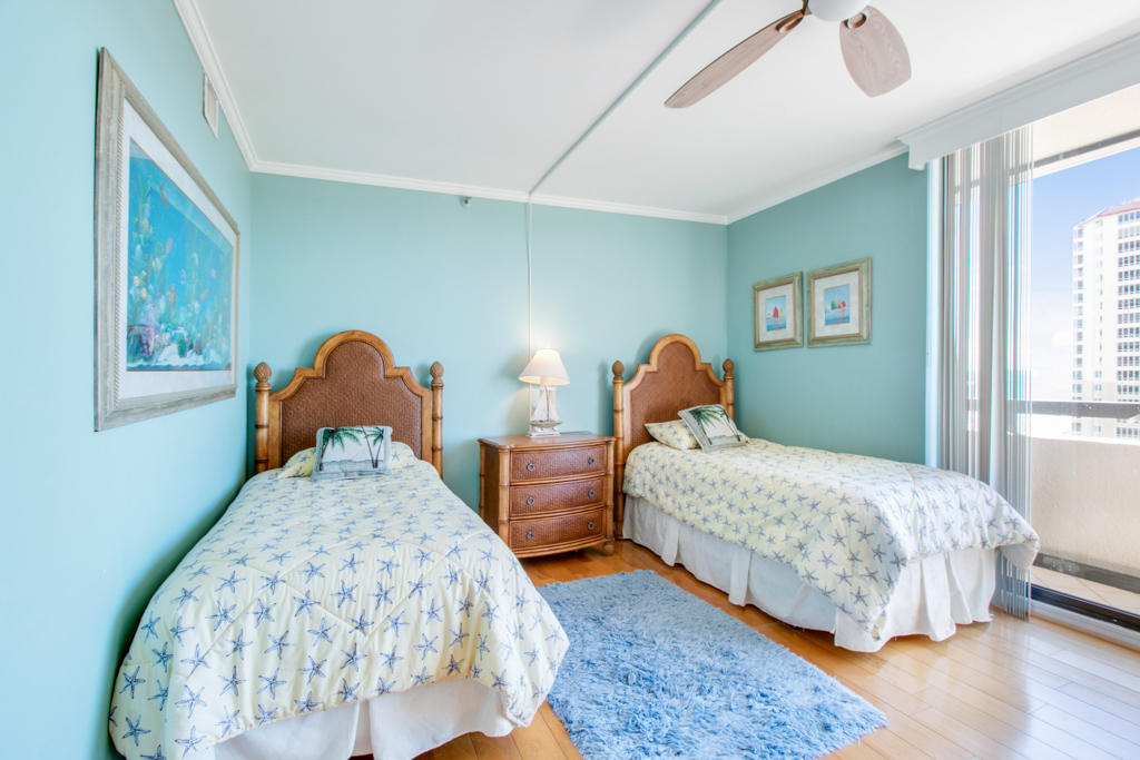 4100 North Ocean Drive, Unit 1002 Singer Island, FL 33404 - Photo 25 of 37 a bedroom with two beds and a window