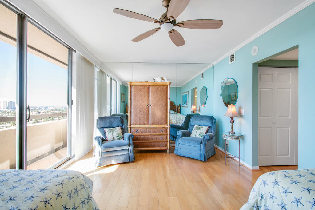 4100 North Ocean Drive, Unit 1002 Singer Island, FL 33404 - Photo 27 of 37 a bedroom with furniture and a large window