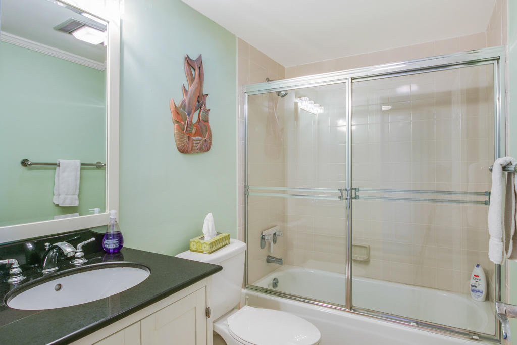 4100 North Ocean Drive, Unit 1002 Singer Island, FL 33404 - Photo 28 of 37 a bathroom with a sink toilet and shower
