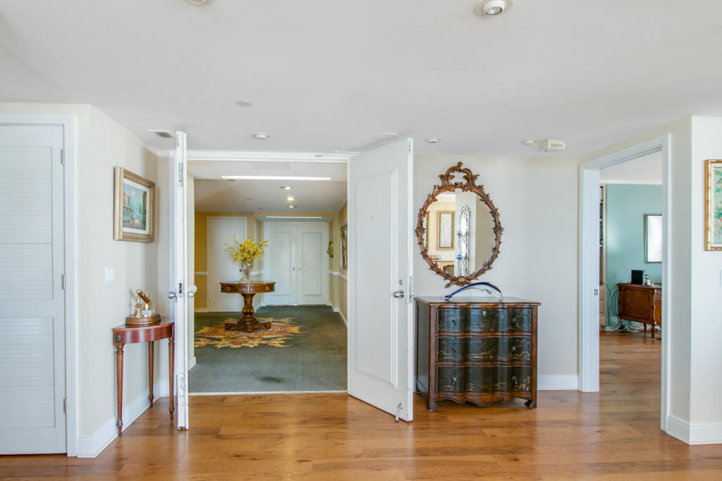 4100 North Ocean Drive, Unit 1002 Singer Island, FL 33404 - Photo 5 of 37 a view of living room filled with furniture and wooden floor